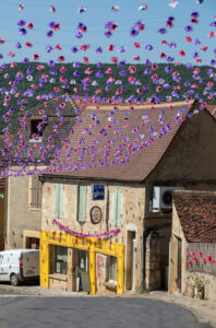 Colourful street decorations during the summer Felibree in Saint Cyprien, France